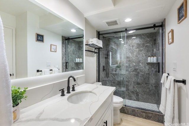 bathroom with toilet, a marble finish shower, vanity, and visible vents