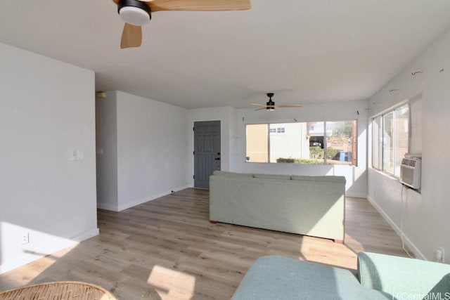 living room with light hardwood / wood-style flooring, cooling unit, and ceiling fan