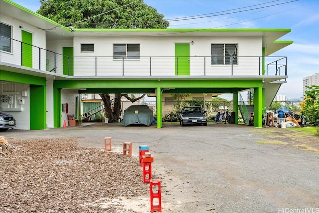 view of parking / parking lot featuring a carport