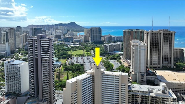 property's view of city featuring a water and mountain view