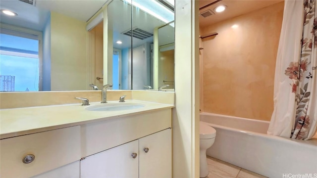 full bathroom featuring tile patterned flooring, vanity, toilet, and shower / bathtub combination with curtain