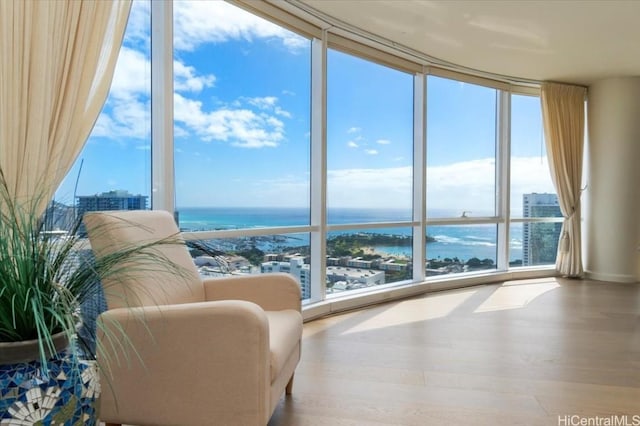 interior space featuring a wealth of natural light and a water view