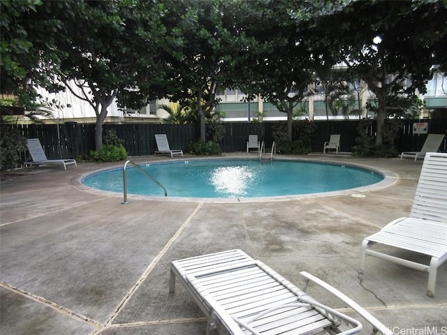 view of swimming pool with a patio