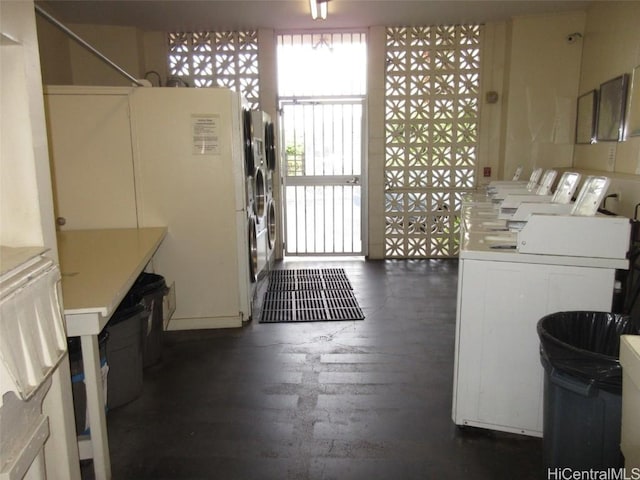 washroom with dark hardwood / wood-style floors and washer / clothes dryer