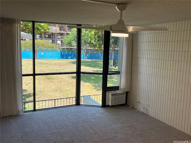 855 Makahiki Way Unit 207, Honolulu, HI 96826 - unfurnished room with carpet, a textured ceiling, cooling unit, and a ceiling fan