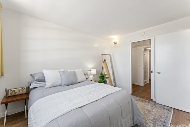 bedroom with hardwood / wood-style flooring