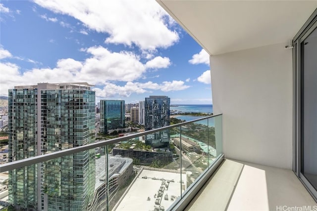 balcony featuring a water view