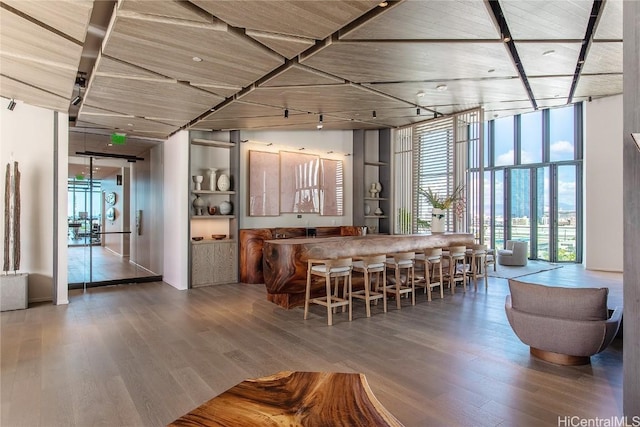 kitchen featuring expansive windows and wood-type flooring