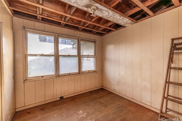 misc room with wood walls and hardwood / wood-style flooring