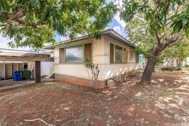 view of side of property featuring a patio area