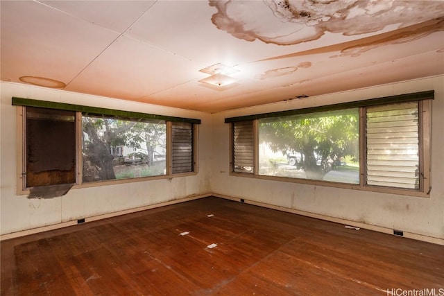 empty room with dark hardwood / wood-style floors