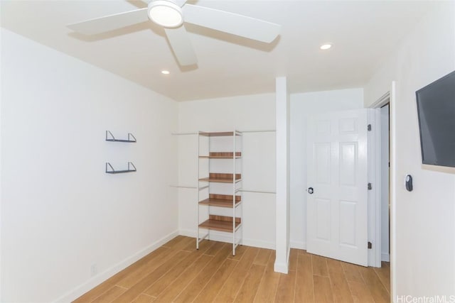 unfurnished bedroom with light wood-type flooring and ceiling fan