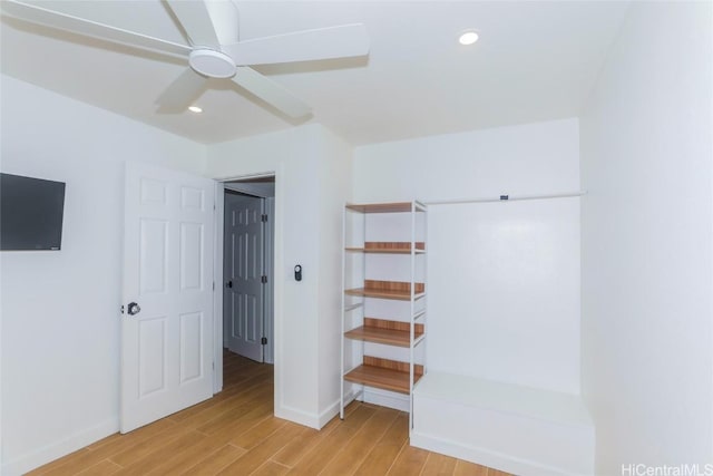 unfurnished bedroom with ceiling fan and light hardwood / wood-style floors