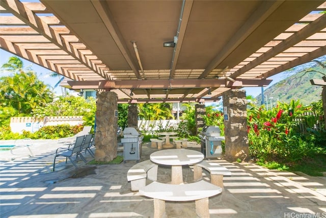 view of patio featuring a pergola and grilling area