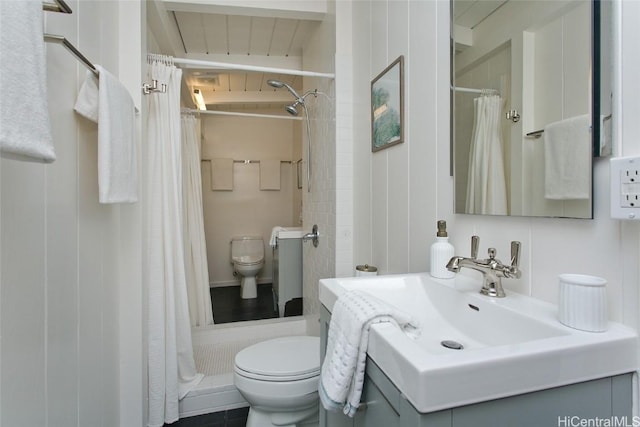 bathroom with walk in shower, vanity, beam ceiling, wooden ceiling, and toilet