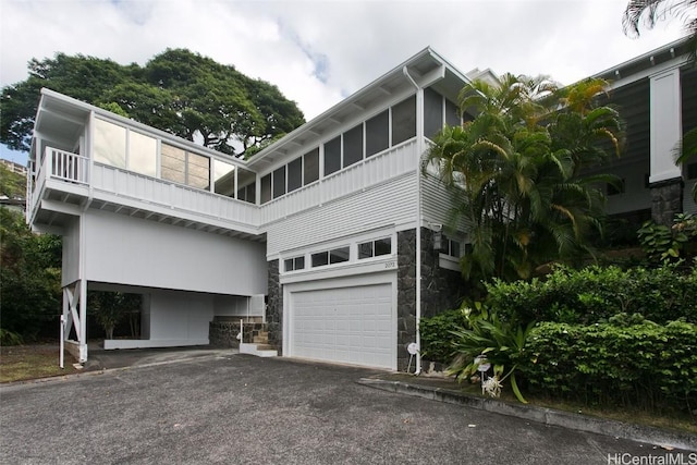 exterior space with a balcony and a garage