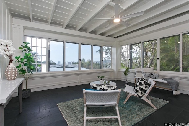 sunroom / solarium with beam ceiling and ceiling fan