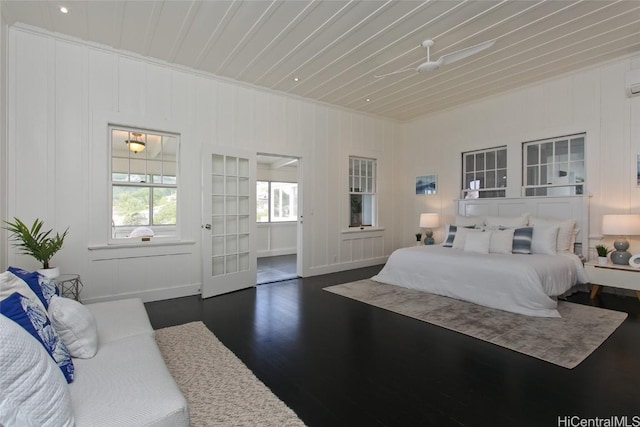 bedroom featuring dark hardwood / wood-style flooring and wood ceiling