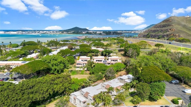 drone / aerial view featuring a water and mountain view