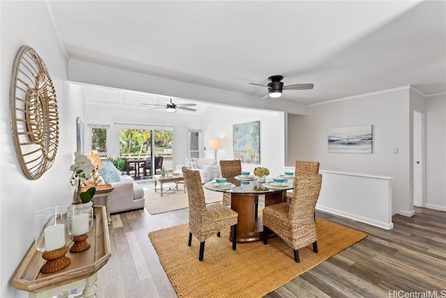 dining room featuring hardwood / wood-style flooring, ceiling fan, and ornamental molding