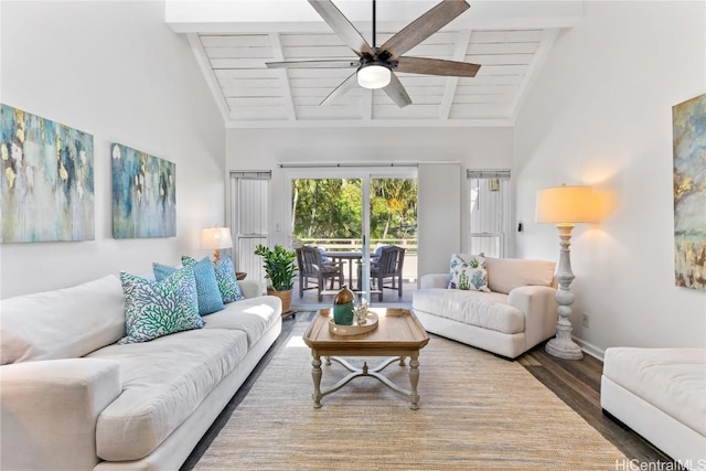 living room with hardwood / wood-style floors, ceiling fan, beamed ceiling, and high vaulted ceiling