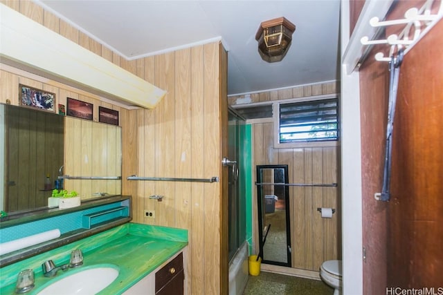 bathroom featuring vanity, toilet, walk in shower, and wooden walls