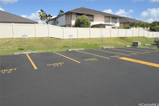 uncovered parking lot with fence