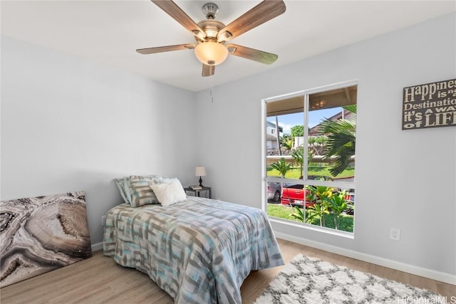 bedroom featuring light hardwood / wood-style flooring and ceiling fan