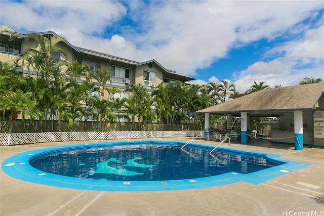 view of swimming pool featuring a patio