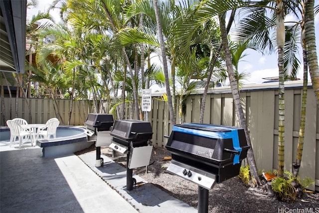 view of patio featuring a grill