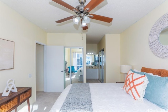 carpeted bedroom with a closet and ceiling fan