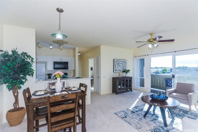 living room with light carpet and ceiling fan