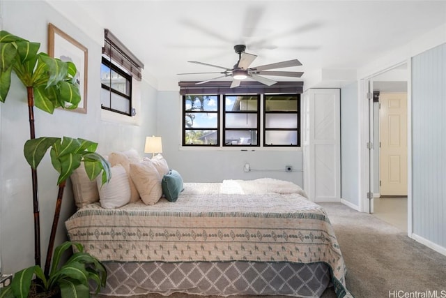 bedroom featuring ceiling fan and carpet floors