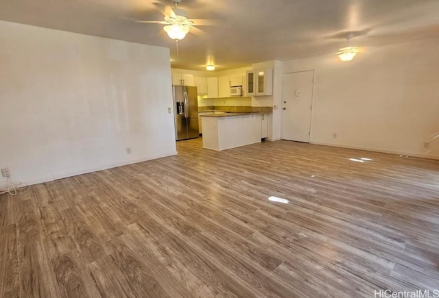 84-754 Ala Mahiku St Unit 52A, Waianae, HI 96792 - unfurnished living room with light hardwood / wood-style flooring and ceiling fan