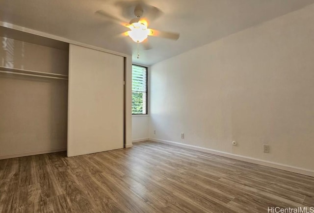 84-754 Ala Mahiku St Unit 52A, Waianae, HI 96792 - unfurnished bedroom featuring ceiling fan, a closet, and wood-type flooring
