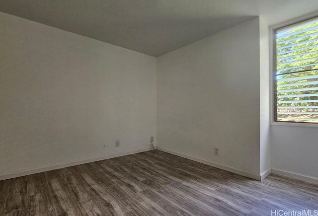 84-754 Ala Mahiku St Unit 52A, Waianae, HI 96792 - empty room with wood-type flooring and a wealth of natural light