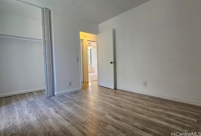 84-754 Ala Mahiku St Unit 52A, Waianae, HI 96792 - unfurnished bedroom featuring wood-type flooring