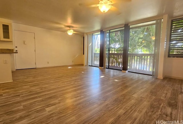 84-754 Ala Mahiku St Unit 52A, Waianae, HI 96792 - interior space featuring hardwood / wood-style flooring, a wall of windows, and ceiling fan