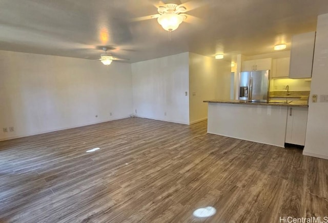 84-754 Ala Mahiku St Unit 52A, Waianae, HI 96792 - unfurnished living room featuring ceiling fan, sink, and dark wood-type flooring