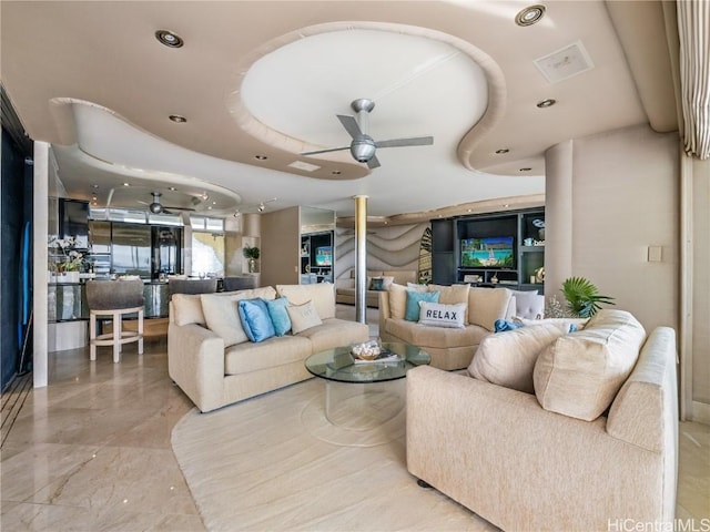 interior space with ceiling fan