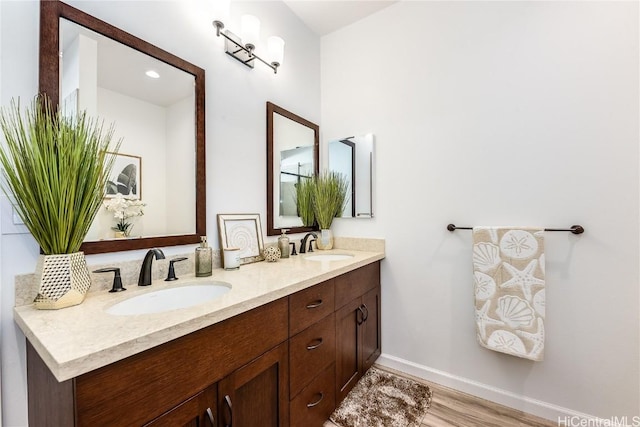 bathroom with vanity and hardwood / wood-style flooring