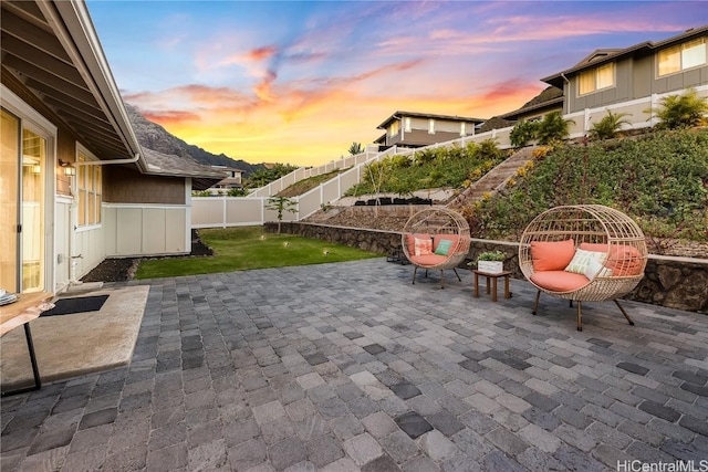 view of patio terrace at dusk