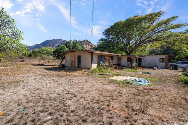 rear view of property with a mountain view