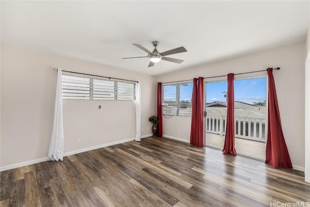 empty room with hardwood / wood-style floors and ceiling fan