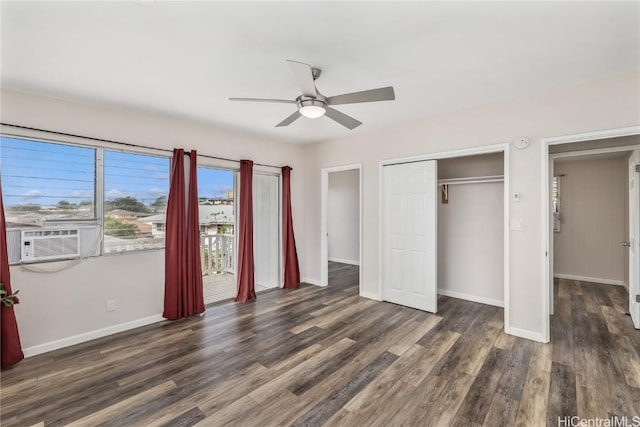 unfurnished bedroom with cooling unit, ceiling fan, dark wood-type flooring, and a closet