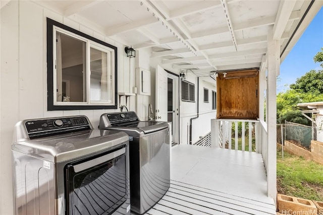 laundry area with separate washer and dryer