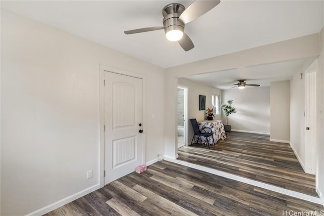 spare room featuring dark hardwood / wood-style floors and ceiling fan