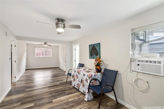 sitting room with ceiling fan and dark hardwood / wood-style flooring