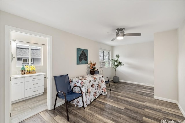 sitting room with hardwood / wood-style floors and ceiling fan