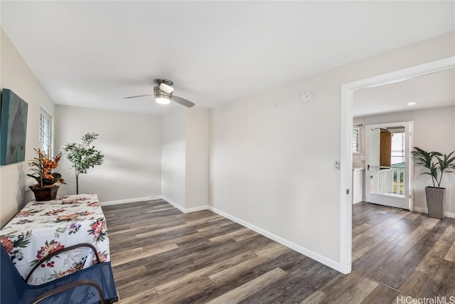 sitting room featuring ceiling fan and dark hardwood / wood-style floors